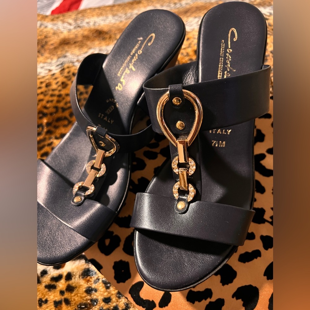 Navy blue wedges. Gold and rhinestone on the top .